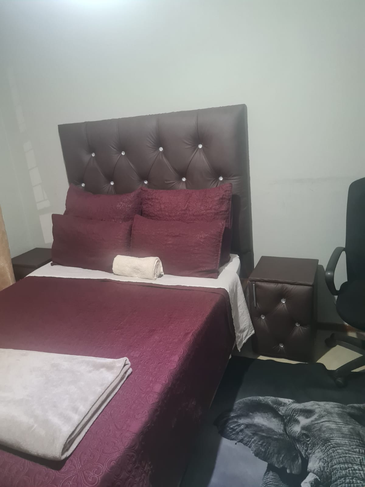 Single room with maroon bedding